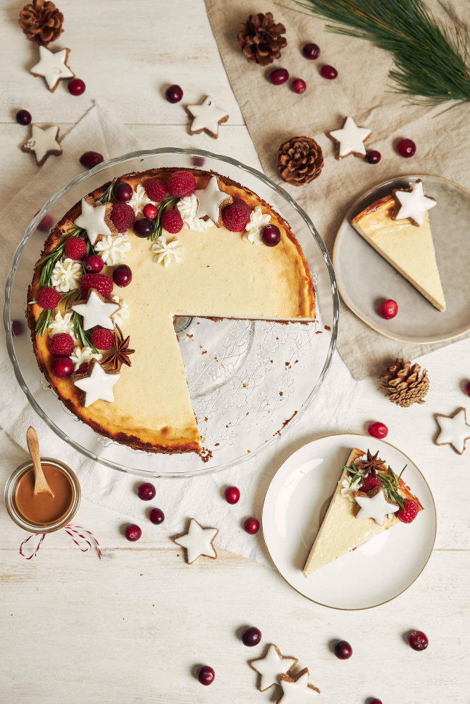 delicious christmas cheesecake with cranberries cookies stars white table